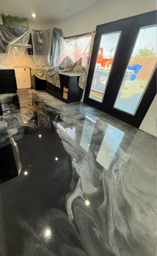 High-gloss black and gray metallic epoxy floor in a San Diego interior
