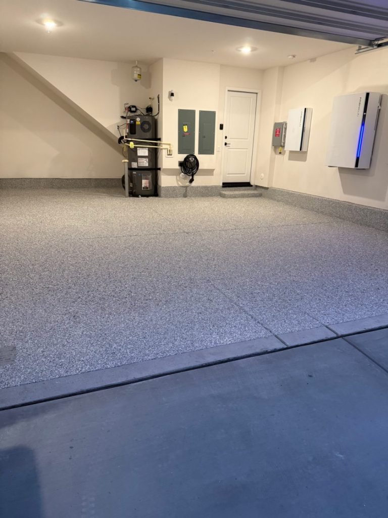 Decorative flake concrete coating for a garage floor by Zenith Heights
