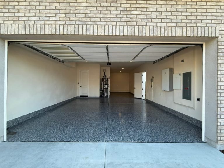 Full-broadcast epoxy flake garage floor with professional concrete preparation