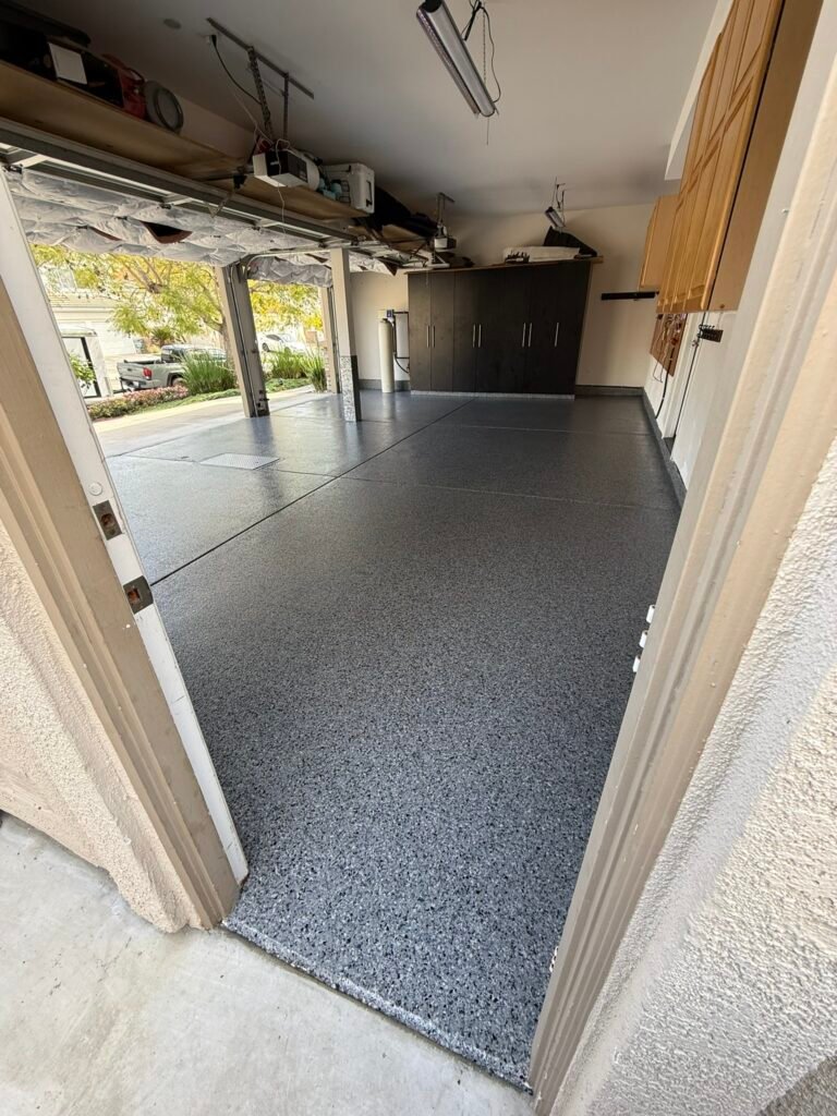 Gray decorative flake garage floor installed by Zenith Heights