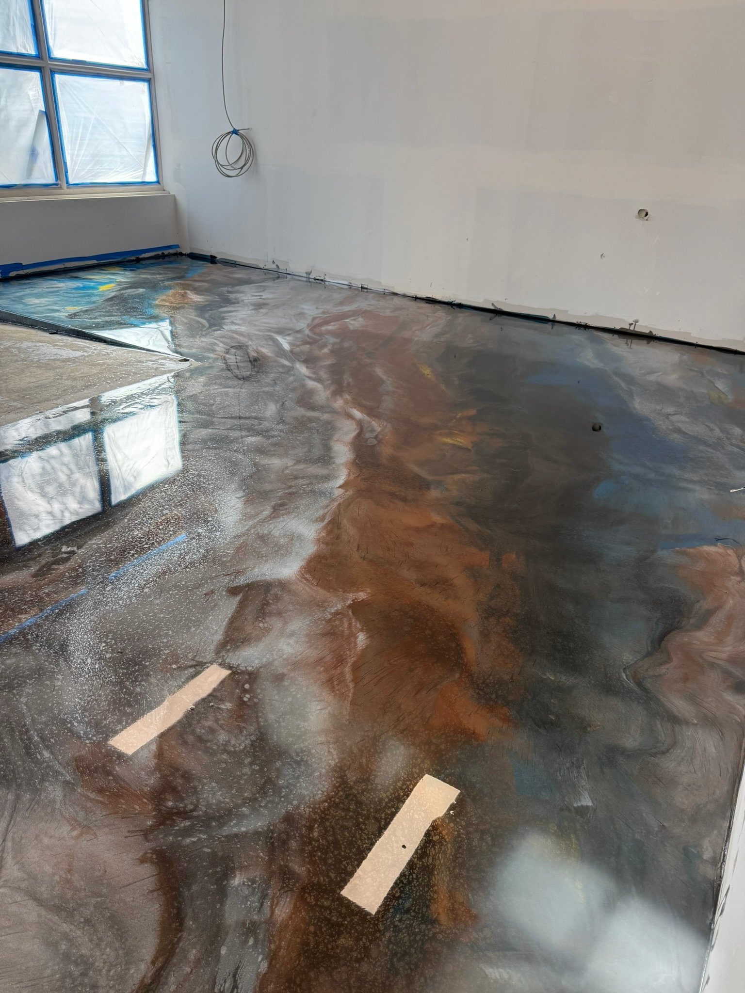 Custom metallic epoxy flooring for a San Diego commercial workspace
