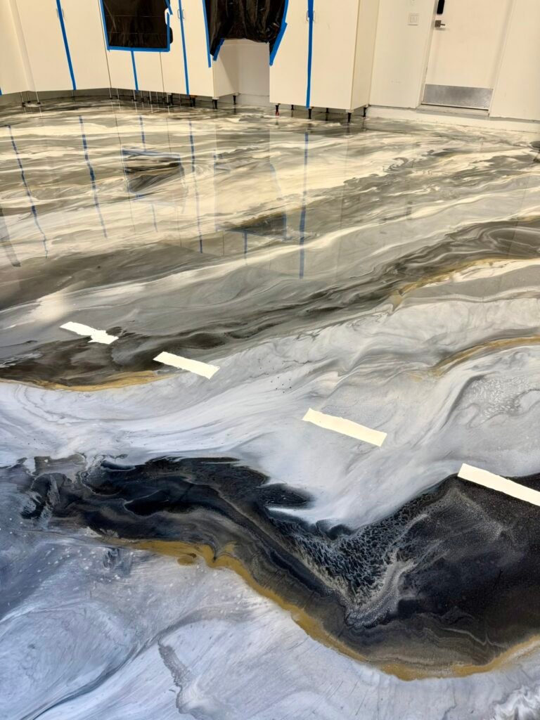 Custom white gray black and gold metallic epoxy floor installed by Zenith Heights in San Diego County