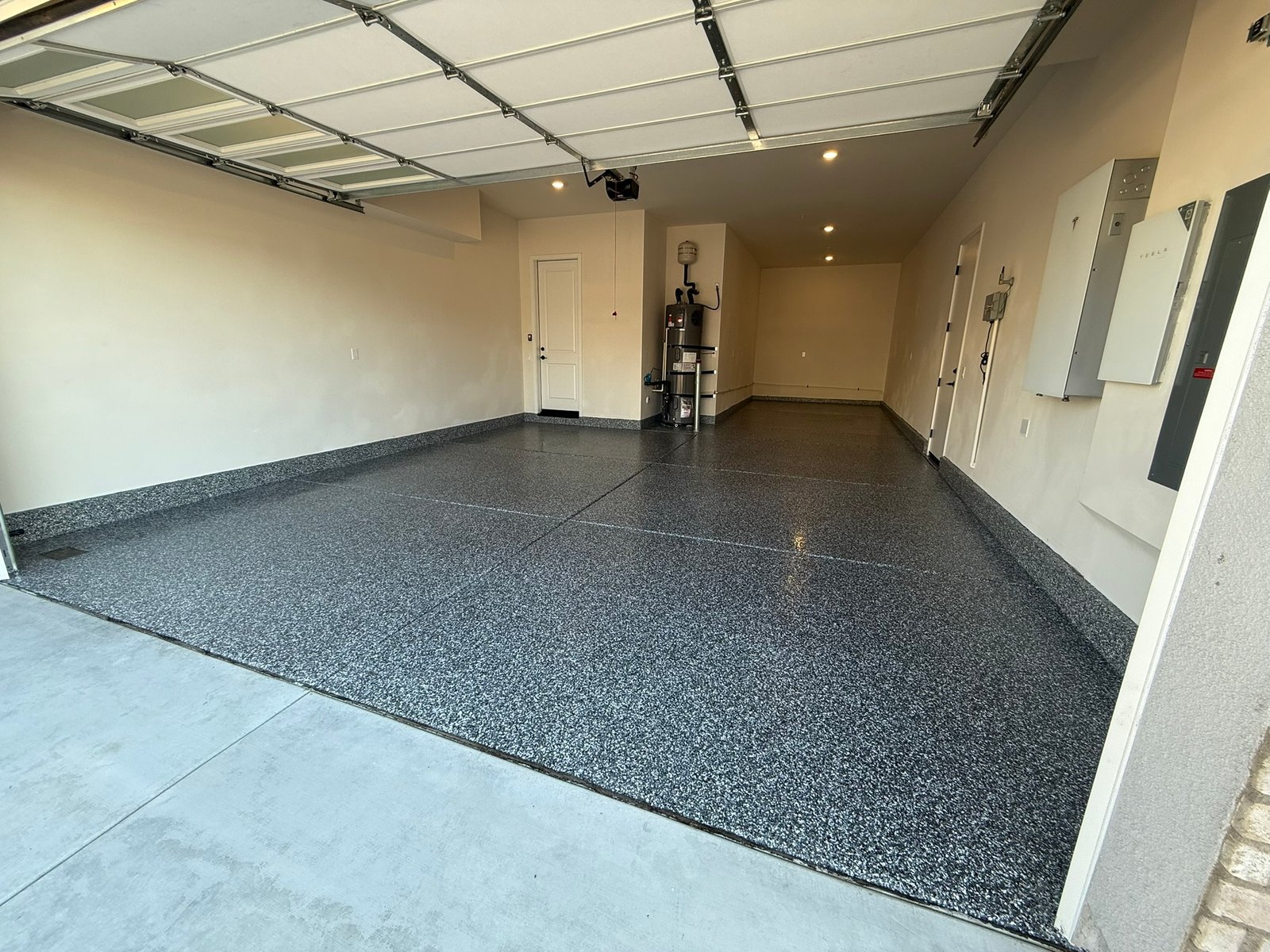 Wombat decorative flake garage floor installed by Zenith Heights Flooring and Epoxy