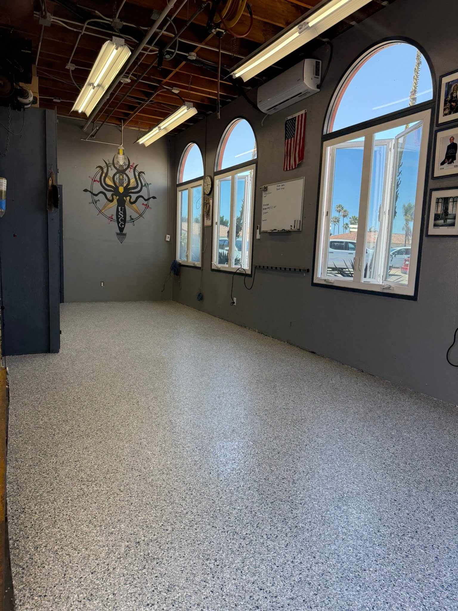 Gray decorative flake epoxy flooring installed in a San Diego commercial facility