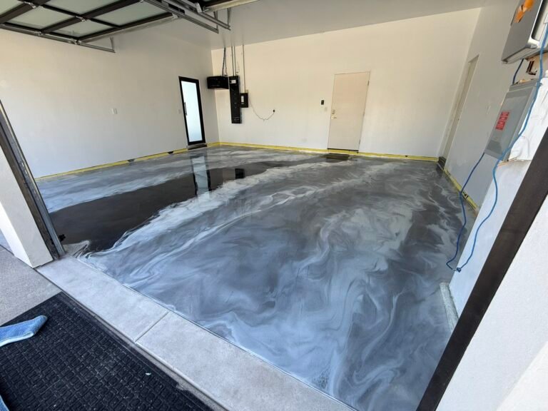 Wide gray and black metallic epoxy garage floor installed in San Diego