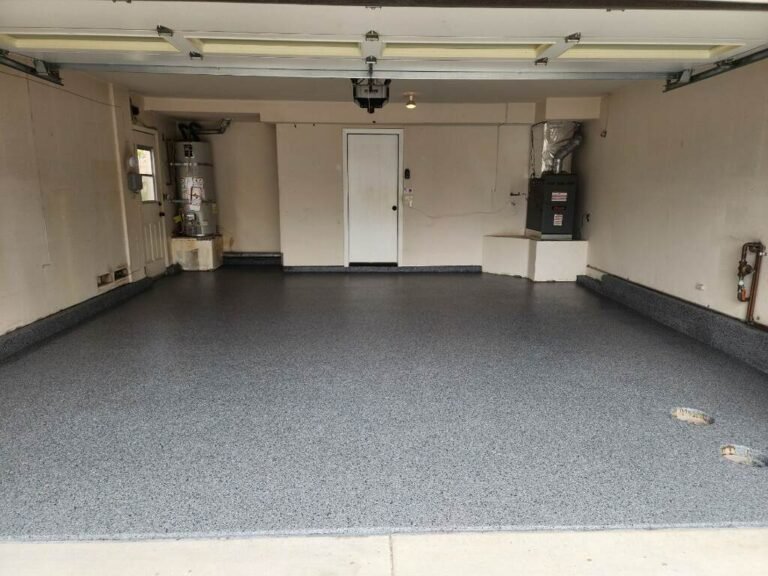 Finished gray full-broadcast flake garage floor