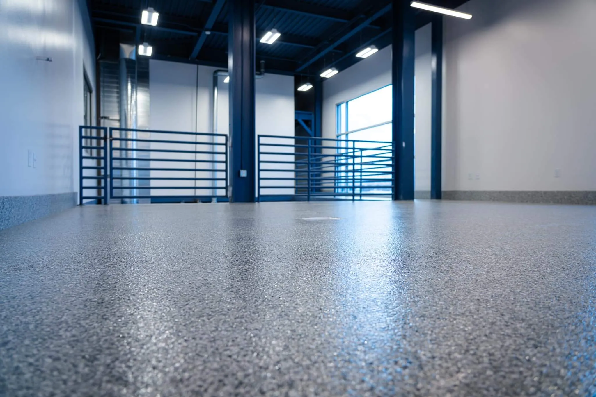 Modern commercial warehouse epoxy floor with a seamless gray coating